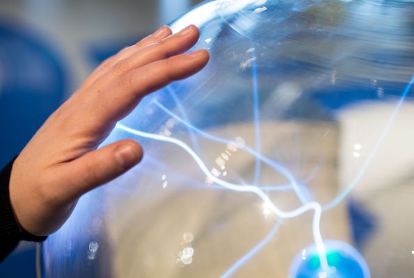 Hand on electric sphere