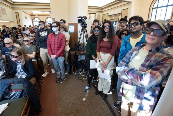 In a live demonstration at the launch of the Public Quantum Network in the Urbana Free Library, members of the public wear polarizing glasses to experience for themselves the measurement of light's polarization.