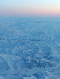 Aerial view of snow covered mountains