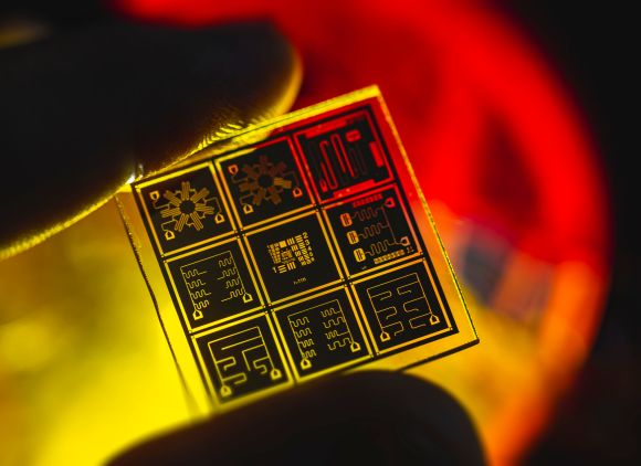 a yellow and orange close-up view of a quantum chip