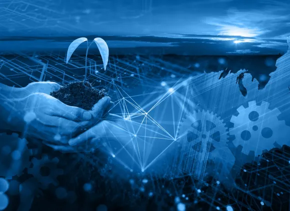 Graphic image showing a US map, cogs and hands holding a seedling under a sunrise.