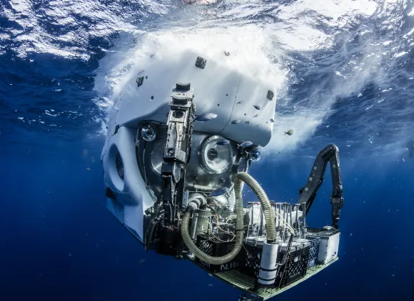 A submersible in the water and breaking the surface.