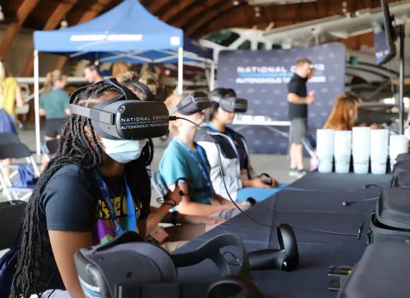 A student wearing a virtual reality headset.