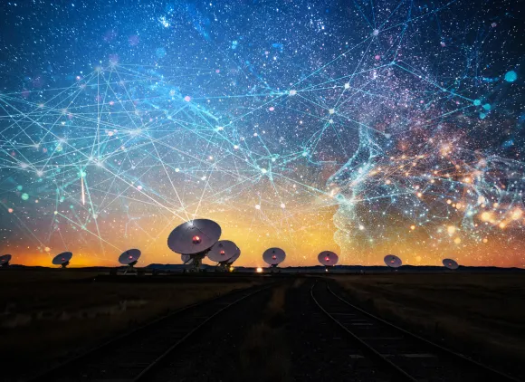 Several large radio telescopes beneath illustration of lines, dots and other imagery in the sky suggesting AI.