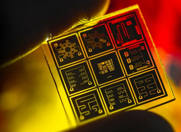 a yellow and orange close-up view of a quantum chip