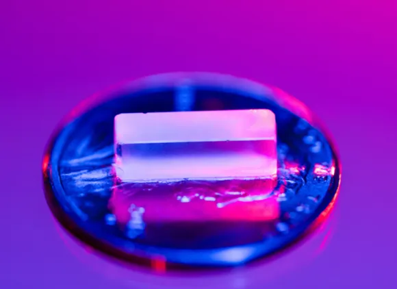 A highly transparent, flourine-rich crystal with thorium-229 atom trapped inside