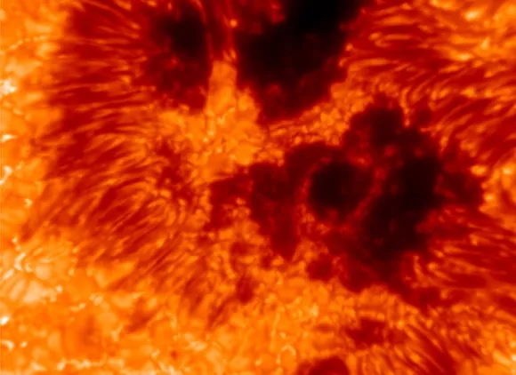 Bright red and orange streaks arranged in curves.