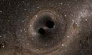 Computer illustration depicting two black holes merging