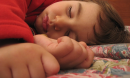 child sleeping on their side