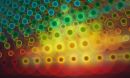 Abstract collage of overlapping, bright-colored glowing circles