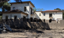 A house in front of a mudflow