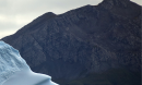 Mountain with iceberg in front