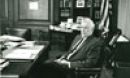 Alan Waterman sitting at a desk