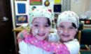 children with brain caps on
