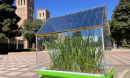 A miniature greenhouse prototype with its roof built of semi-transparent solar cells.