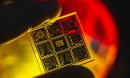 a yellow and orange close-up view of a quantum chip