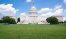 United States Capitol Building, grass in the foreground and blue sky in the background.