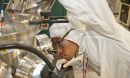 male scientist looking at equipment