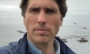 portrait of Chris McCarthy with light brown hair and wearing a blue jacket