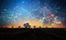 Several large radio telescopes beneath illustration of lines, dots and other imagery in the sky suggesting AI.