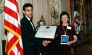 Chaitan S. Khosla and Rita Colwell, NSF Director holding a framed plaque award