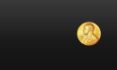 The circular, golden Nobel Prize medal, featuring a portrait of Alfred Nobel, against a black background.