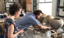 Archeologists sorting clay artifacts