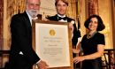 Austin (center), with National Science Board Member Vint Cerf (left), and NSF Director France Córdova holding a framed plaque
