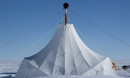 a tent in the middle of an ice field