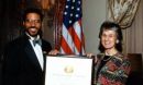Erich D. Jarvis and Rita Colwell, NSF Director holding a framed plaque award