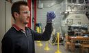 A researcher standing in a research facility.