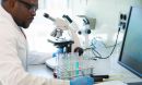 African-american man working in lab. Scientist doctor making medical research.