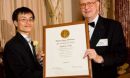 Peidong Yang with Arden L. Bement, Jr., NSF Director holding a framed award