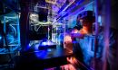 A researcher uses an inverted fluorescence microscope to image cancer cells