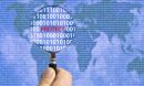 hand holding a magnifying glass over the world map with the word protect