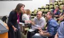 Michelle Smith talking with people in a lecture hall