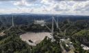 The 900-ton instrument platform at Arecibo Observatory's 305-meter telescope hanging 405 feet above the telescope's dish.
