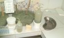 French green clays in pots, bottles and soap on a counter