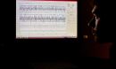 man looking at EEG data on the screen