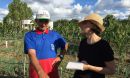 Maria Carmen Lemos talking to a local man