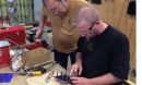 Instructor working with a student at a technology center