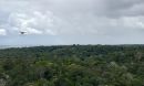 a drone flies toward a rainstorm in the Amazon