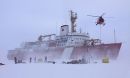 crew members deploy equipment onto the ice from a Canadian icebreaker