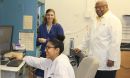 Warner and students in lab.