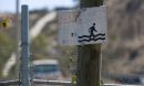Placards posted in the Tijuana River Valley