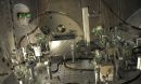 NSF LIGO specialist checks the alignment of a test beam