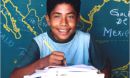 Boy in front of map.