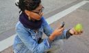 Photo of a young woman taking a photo for a paper prototype used to demonstrate the Forage City app.