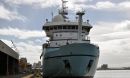R/V Sikuliaq fueling up in a port before its research cruise in the western Pacific.