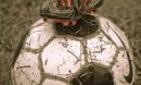 Photo of a soccer player's foot on the ball.